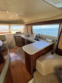 the inside of a boat with a couch and a sink