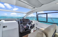 the interior of a boat with a view of the ocean