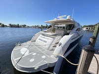 a boat docked at a dock in a marina