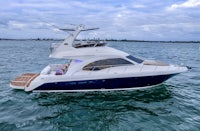 a white and blue motor boat on the water