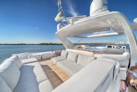 a view of a yacht with couches and a view of the water