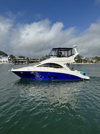 a blue and white boat in the water