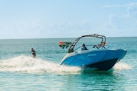 a man is riding a speed boat in the ocean