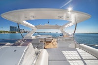 a view of a white motor yacht on the water