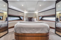 a yacht with a bed in the middle of the room