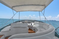 the interior of a boat with white leather seats