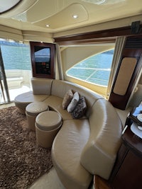 the interior of a boat with a couch and tv