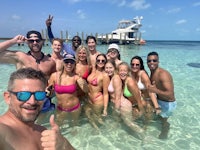 a group of people posing for a picture in the water