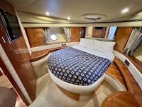 a boat with a bed in the middle of it