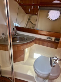 a bathroom in a boat with a toilet and sink