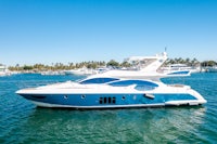 a blue and white boat in the water