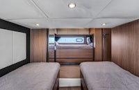 the interior of a motor home with two beds