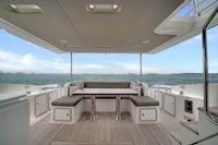 the interior of a boat with a table and chairs