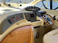 the interior of a boat with a steering wheel and steering wheel