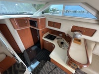 a boat with a kitchen and dining area