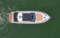 an aerial view of a motor boat in the water