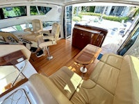 the interior of a boat with leather furniture