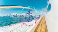 an image of a boat with flowers on it and a city in the background