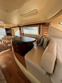 the interior of a boat with a couch and a table