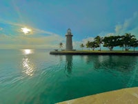 a lighthouse on a small island in the water