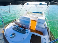 the interior of a boat with a view of the ocean