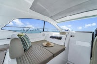 the interior of a boat with a view of the ocean